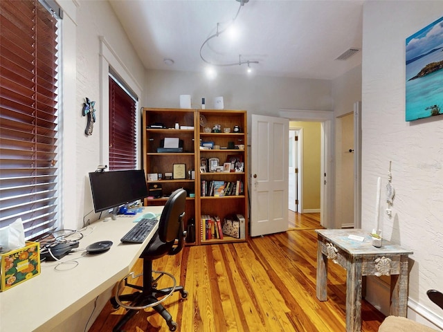 536 Faulkner St, New Smyrna Beach, FL 32168 - home office with visible vents and light wood finished floors