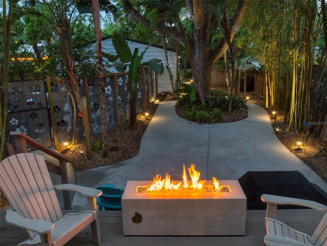 536 Faulkner St, New Smyrna Beach, FL 32168 - view of patio / terrace with a fenced backyard and an outdoor fire pit