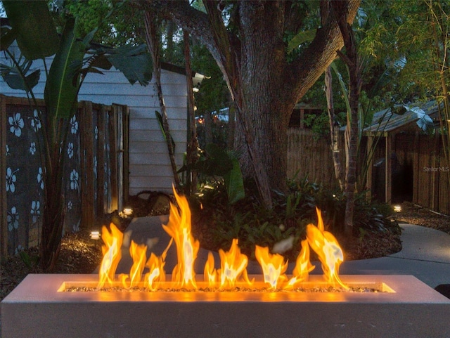 536 Faulkner St, New Smyrna Beach, FL 32168 - details featuring a fire pit and fence