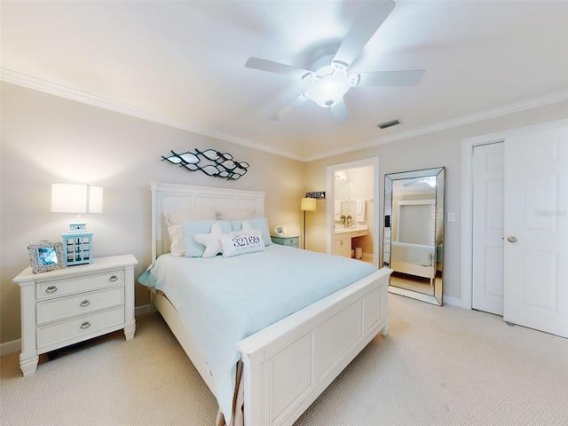 2700 N Peninsula Ave Unit 114, New Smyrna Beach, FL 32169 - bedroom with crown molding, light colored carpet, baseboards, connected bathroom, and ceiling fan