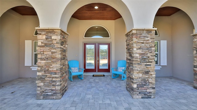 2904 Palma Ln, New Smyrna Beach, FL 32168 - doorway to property featuring stucco siding and french doors