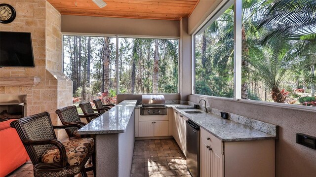 2904 Palma Ln, New Smyrna Beach, FL 32168 - sunroom with a sink, healthy amount of natural light, and wooden ceiling