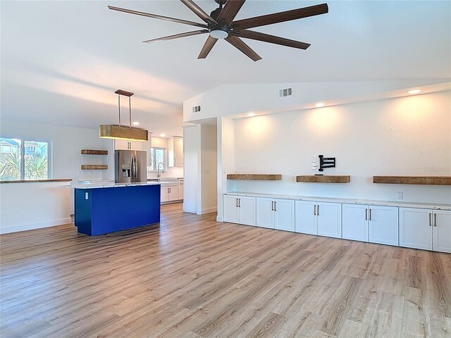 6937 Turtlemound Rd, New Smyrna Beach, FL 32169 - unfurnished living room with light wood-style floors, ceiling fan, and recessed lighting