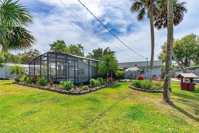 view of yard with glass enclosure