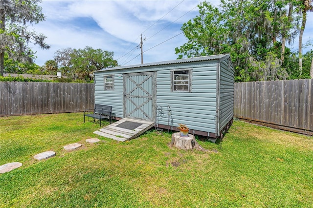 view of shed featuring a fenced backyard
