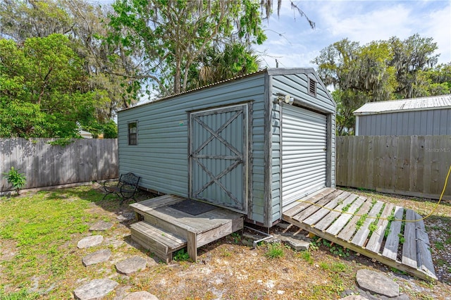 view of shed with a fenced backyard