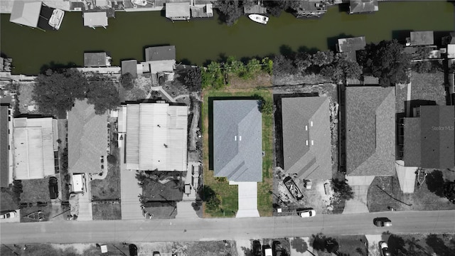 birds eye view of property with a residential view and a water view