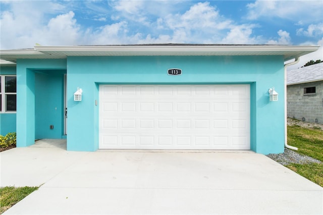 113 Douglas St, Edgewater, FL 32141 - garage featuring concrete driveway