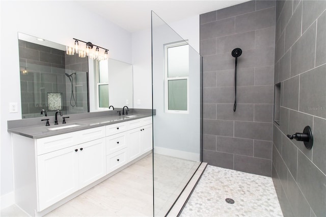 113 Douglas St, Edgewater, FL 32141 - full bathroom featuring a walk in shower, double vanity, and baseboards