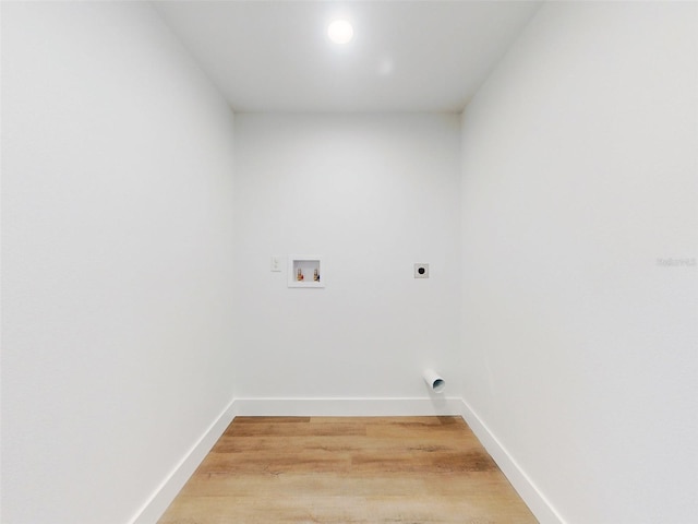 laundry room featuring washer hookup, baseboards, laundry area, hookup for an electric dryer, and light wood-style floors
