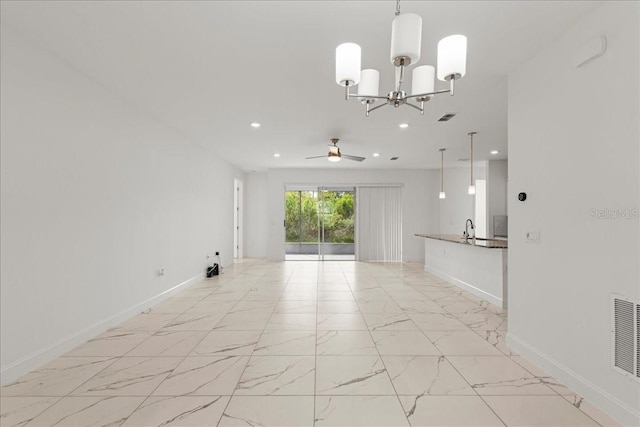 11 Lyons Pl, Palm Coast, FL 32137 - unfurnished living room featuring baseboards, ceiling fan, light marble finish flooring, recessed lighting, and a chandelier