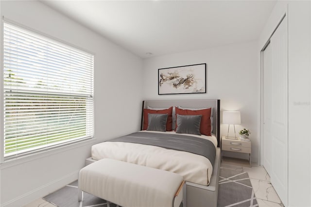 11 Lyons Pl, Palm Coast, FL 32137 - bedroom with a closet and light marble finish floors