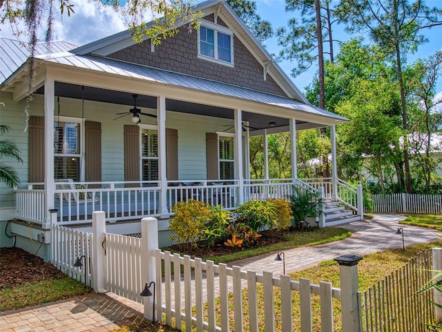 2656 Old Smyrna Trl, New Smyrna Beach, FL 32168 - view of front of home with covered porch, ceiling fan, and metal roof