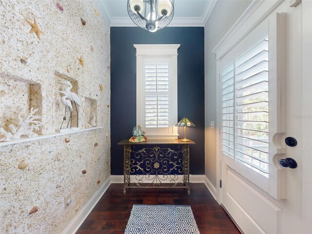 2656 Old Smyrna Trl, New Smyrna Beach, FL 32168 - entryway with baseboards, a notable chandelier, wood finished floors, and ornamental molding
