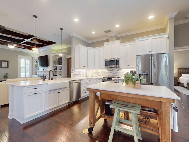 2656 Old Smyrna Trl, New Smyrna Beach, FL 32168 - kitchen with visible vents, a peninsula, appliances with stainless steel finishes, white cabinetry, and a sink