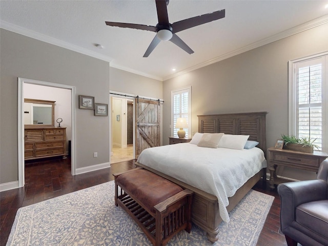 2656 Old Smyrna Trl, New Smyrna Beach, FL 32168 - bedroom featuring a barn door, wood-type flooring, ensuite bath, baseboards, and ornamental molding