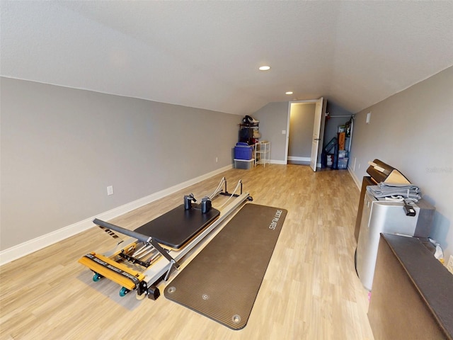 2656 Old Smyrna Trl, New Smyrna Beach, FL 32168 - workout area with light wood-style flooring, baseboards, vaulted ceiling, and recessed lighting