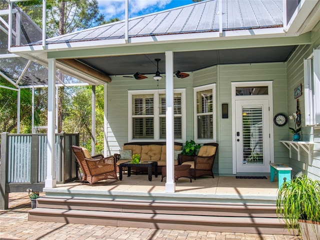 2656 Old Smyrna Trl, New Smyrna Beach, FL 32168 - exterior space with an outdoor hangout area, glass enclosure, and ceiling fan