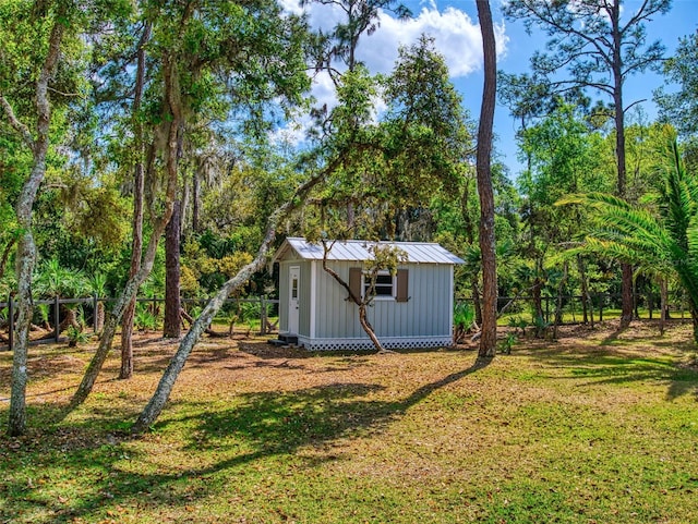 2656 Old Smyrna Trl, New Smyrna Beach, FL 32168 - view of yard featuring a shed, an outdoor structure, and fence