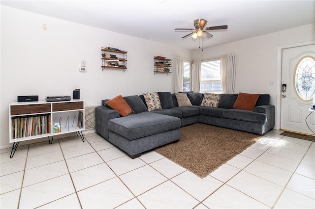 7585 Kavanda St, North Port, FL 34287 - living room with ceiling fan and light tile patterned floors