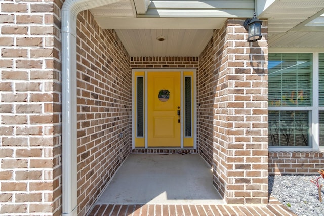 208 Lagoon Mist Ct, Oak Hill, FL 32759 - view of exterior entry featuring brick siding