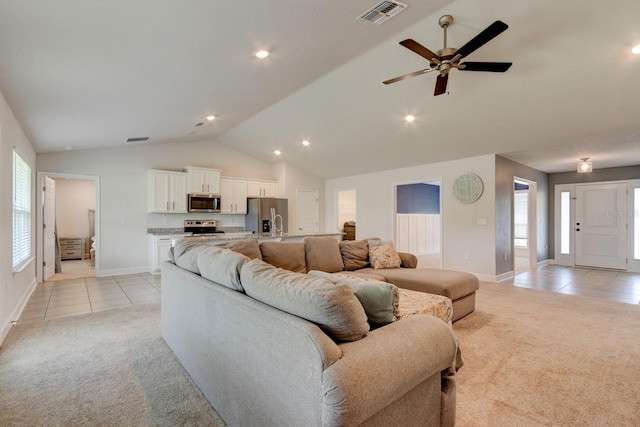 208 Lagoon Mist Ct, Oak Hill, FL 32759 - living area featuring a ceiling fan, light tile patterned floors, light colored carpet, and visible vents