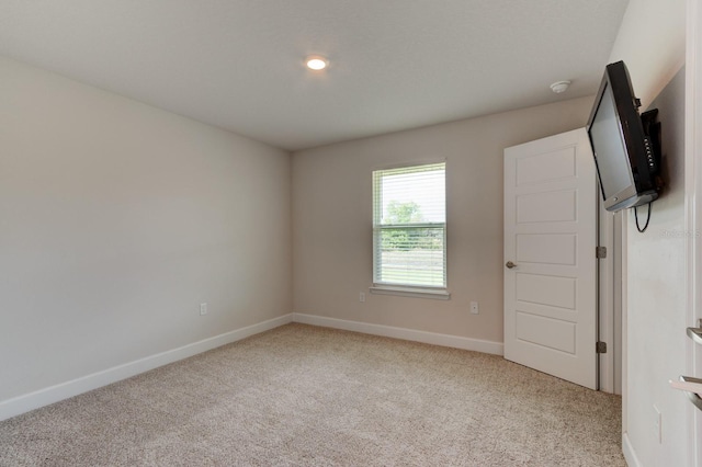 208 Lagoon Mist Ct, Oak Hill, FL 32759 - unfurnished room with baseboards and light colored carpet