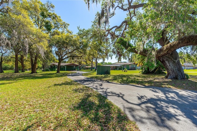 191 Howes St, Oak Hill, FL 32759 - view of front of property with driveway and a front lawn