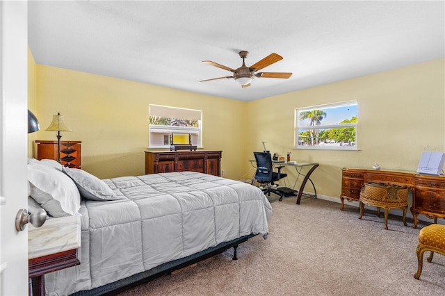 191 Howes St, Oak Hill, FL 32759 - carpeted bedroom with baseboards and a ceiling fan