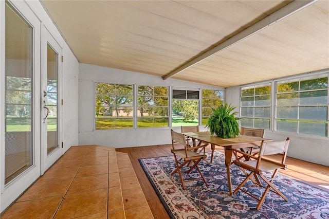 191 Howes St, Oak Hill, FL 32759 - sunroom / solarium featuring outdoor dining space, vaulted ceiling with beams, a wooden deck, and wood finished floors