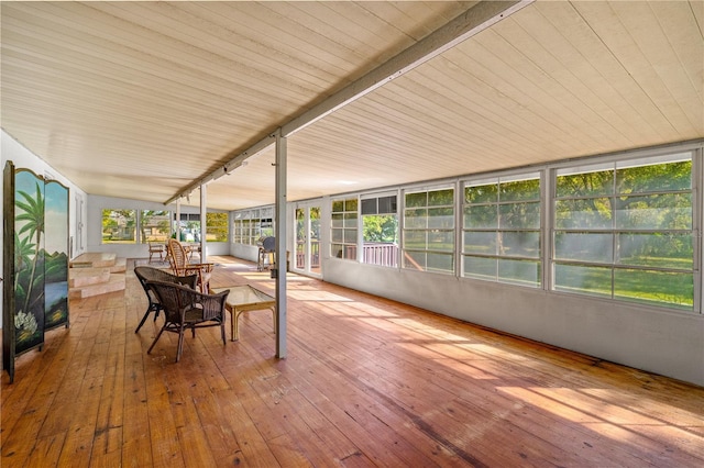 191 Howes St, Oak Hill, FL 32759 - unfurnished sunroom with a deck, hardwood / wood-style flooring, and a healthy amount of sunlight