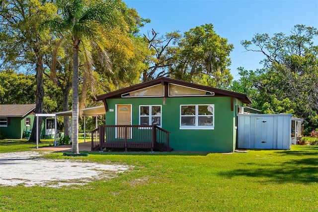 191 Howes St, Oak Hill, FL 32759 - back of property featuring a yard and stucco siding