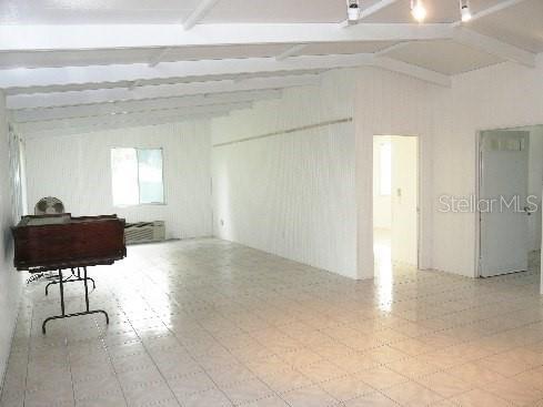 191 Howes St, Oak Hill, FL 32759 - miscellaneous room featuring lofted ceiling with beams