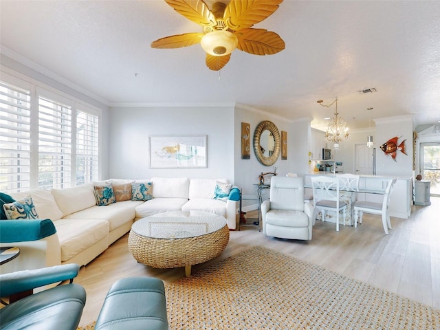 438 Bouchelle Dr Unit 104, New Smyrna Beach, FL 32169 - living area with ceiling fan with notable chandelier, crown molding, light wood-style floors, and visible vents