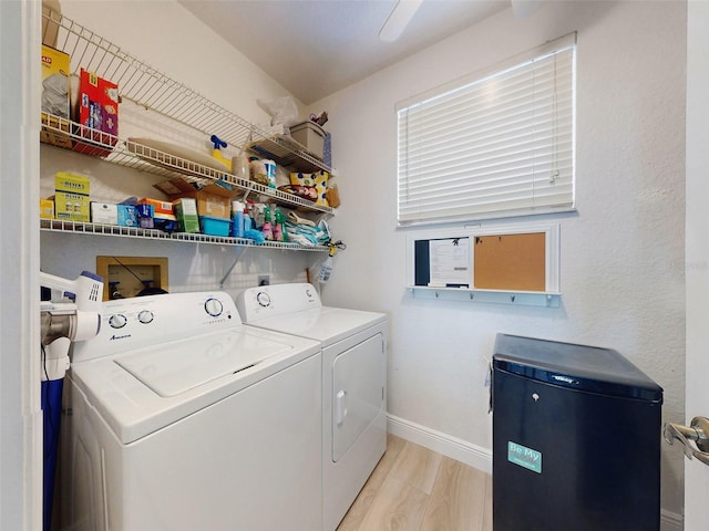 438 Bouchelle Dr Unit 104, New Smyrna Beach, FL 32169 - laundry area with baseboards, laundry area, and washer and clothes dryer