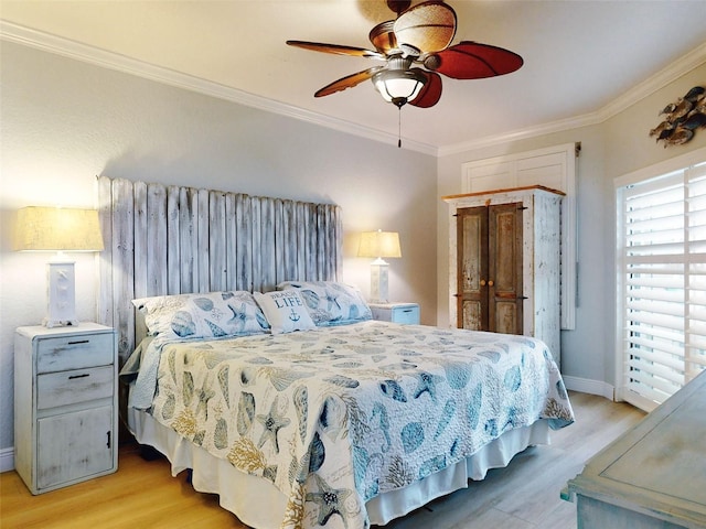 438 Bouchelle Dr Unit 104, New Smyrna Beach, FL 32169 - bedroom featuring baseboards, a ceiling fan, light wood-type flooring, and crown molding
