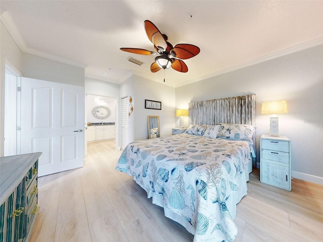 438 Bouchelle Dr Unit 104, New Smyrna Beach, FL 32169 - bedroom with visible vents, baseboards, ornamental molding, connected bathroom, and light wood-type flooring