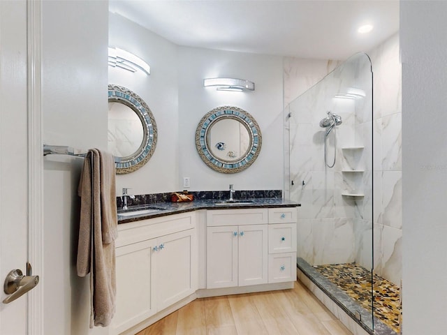 438 Bouchelle Dr Unit 104, New Smyrna Beach, FL 32169 - full bathroom with double vanity, a sink, and a walk in shower