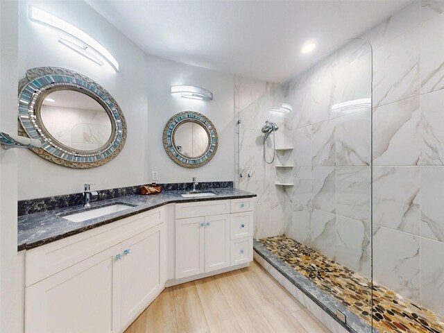 438 Bouchelle Dr Unit 104, New Smyrna Beach, FL 32169 - full bath featuring double vanity, wood finished floors, a walk in shower, and a sink