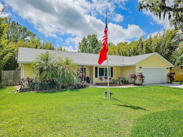 single story home with fence, a front lawn, an attached garage, a shingled roof, and concrete driveway