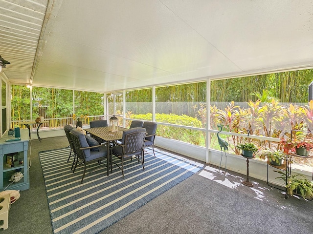 sunroom with outdoor dining area