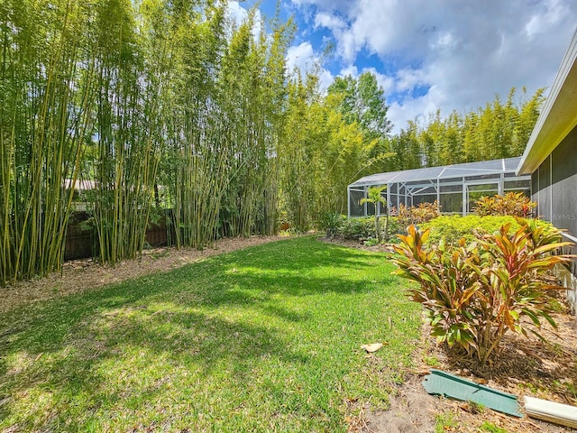 view of yard with a lanai
