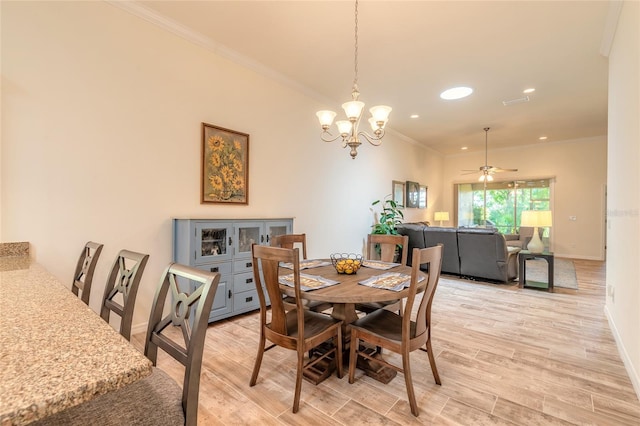 3331 Torre Blvd, New Smyrna Beach, FL 32168 - dining area with recessed lighting, baseboards, ornamental molding, and light wood-type flooring