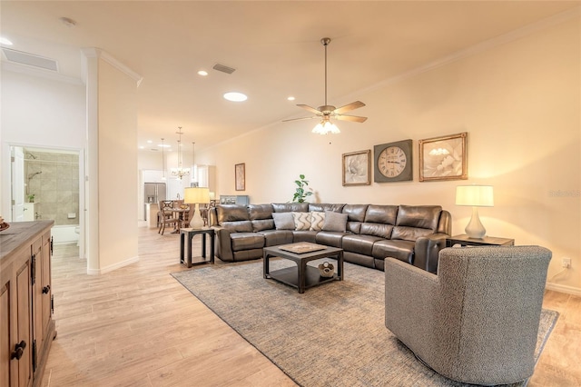 3331 Torre Blvd, New Smyrna Beach, FL 32168 - living room featuring visible vents, ornamental molding, baseboards, recessed lighting, and light wood-type flooring