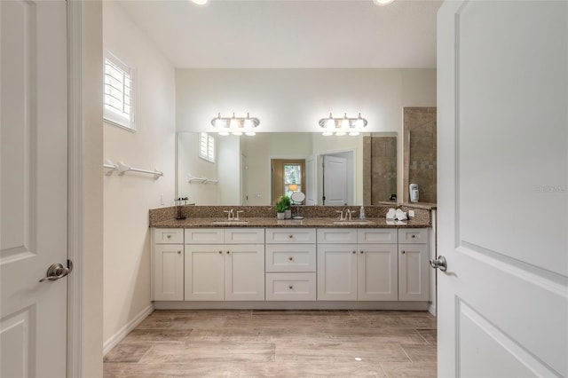 3331 Torre Blvd, New Smyrna Beach, FL 32168 - bathroom featuring a sink, tiled shower, and a healthy amount of sunlight