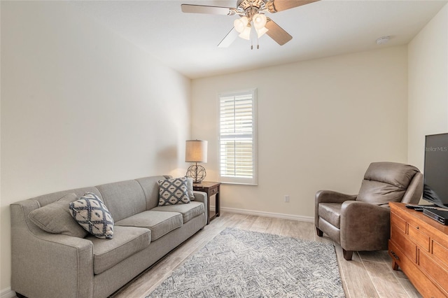 3331 Torre Blvd, New Smyrna Beach, FL 32168 - living room featuring ceiling fan, baseboards, and light wood finished floors
