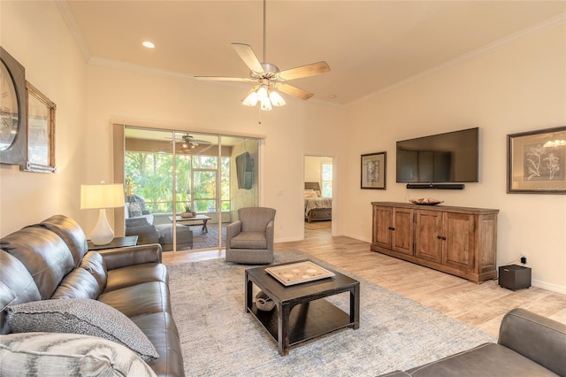 3331 Torre Blvd, New Smyrna Beach, FL 32168 - living room featuring baseboards, ornamental molding, light wood-style flooring, and ceiling fan