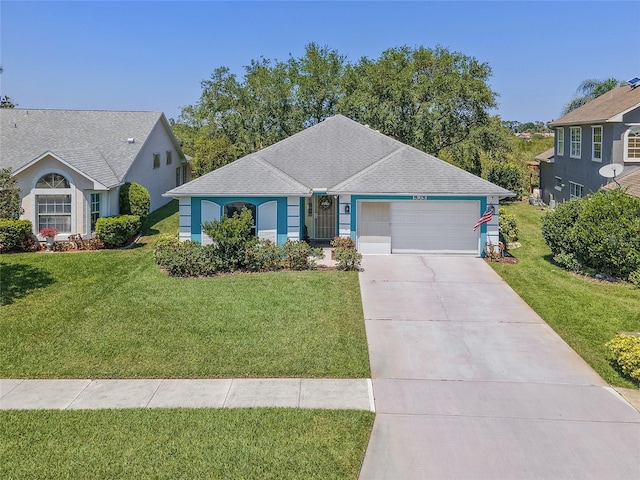 ranch-style house with concrete driveway, a shingled roof, a front lawn, and an attached garage