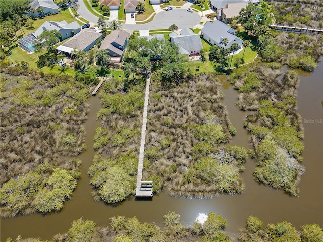 aerial view featuring a water view and a residential view