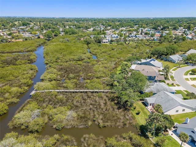 drone / aerial view featuring a residential view and a water view